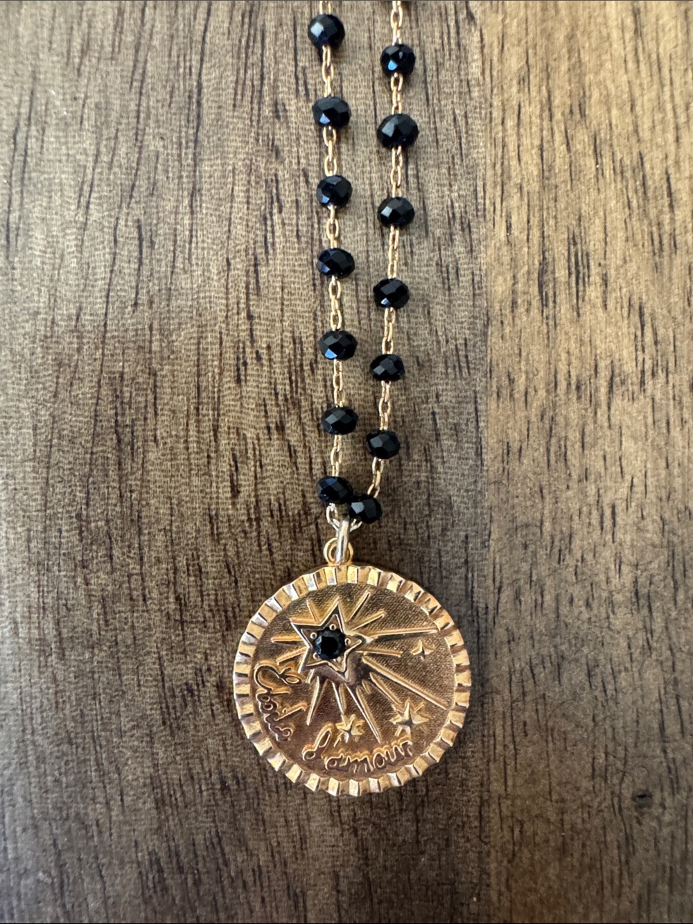 Gold-Tone Starburst Pendant Necklace with Black Beads